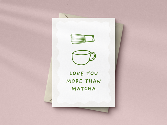 Funny green 'Love You More Than Matcha' greeting card with minimalist matcha whisk and cup design for Valentine's or Anniversary.