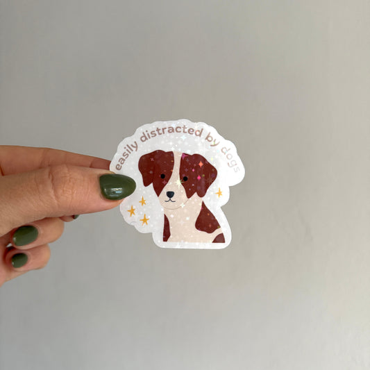ute holographic spaniel sticker that says "easily distracted by dogs". Waterproof, scratch resistant. Perfect for journals, laptops & more.