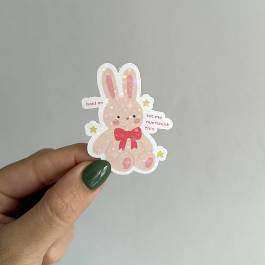 Cute holographic bunny sticker that says "hold on let me overthink this". Waterproof, scratch resistant. Perfect for journals, laptops & more.