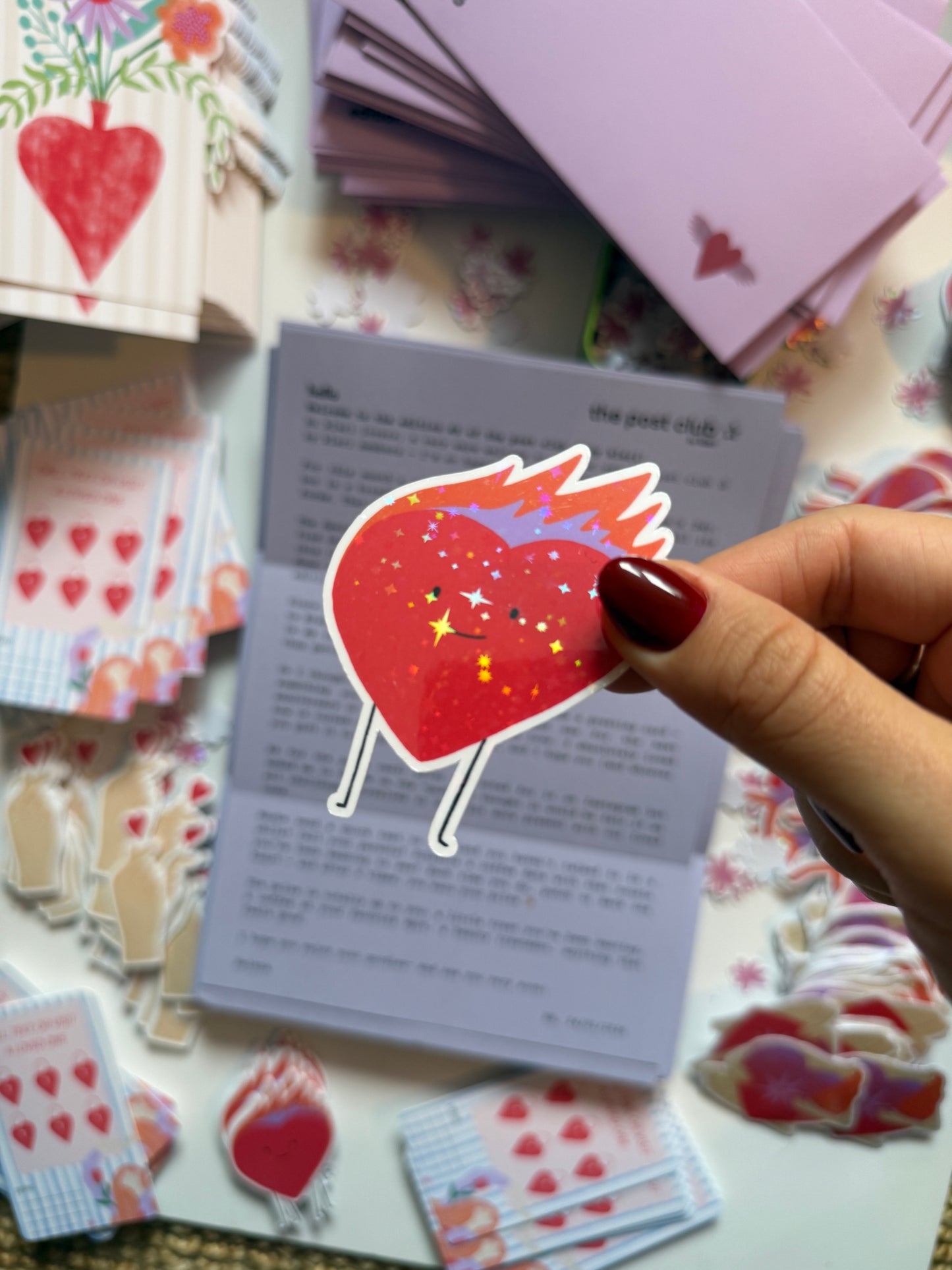 ute holographic sticker of a smiling heart on fire with sparkles. Waterproof, scratch resistant, approx. 4x5cm. Perfect for journals, laptops & more